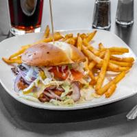 Classic Cheeseburger · 100% beef patty topped with real Cheddar cheese, lettuce, tomato, onion, pickle, mayonnaise,...
