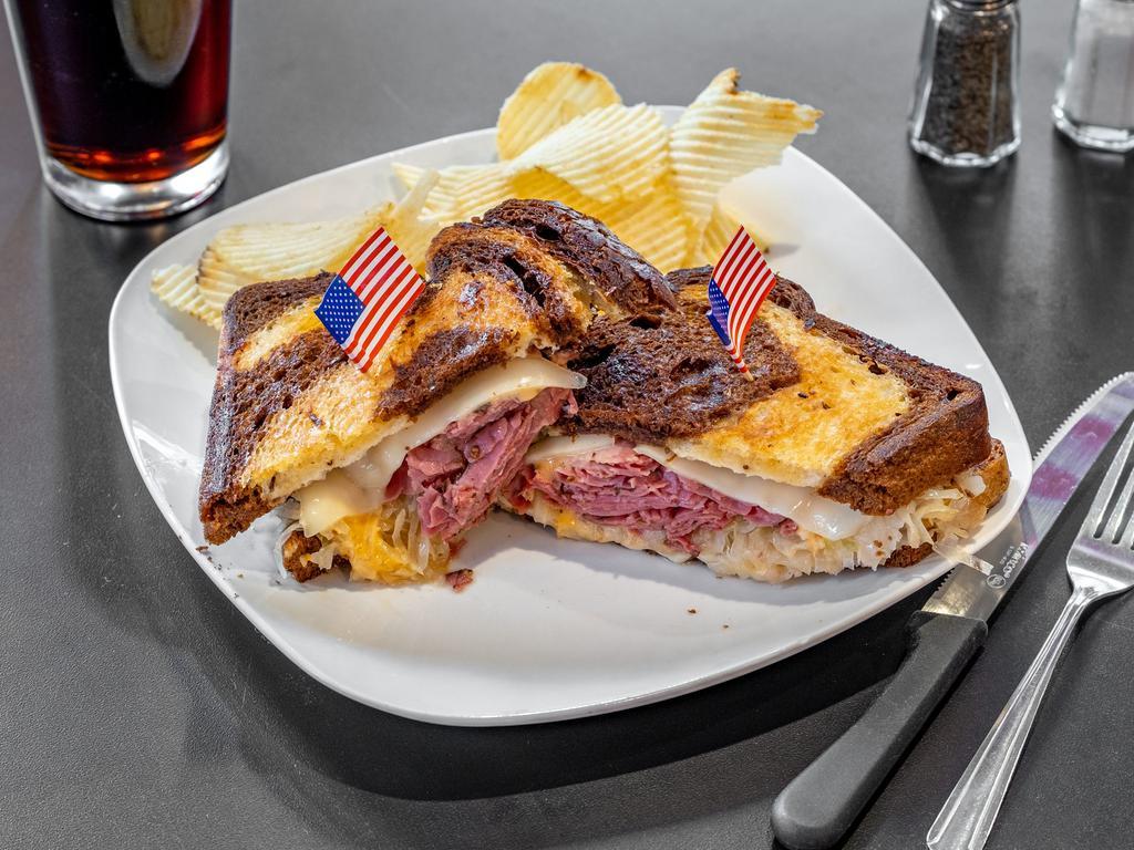 Reuben Sandwich · Thinly sliced pastrami with melted Swiss cheese, Kosher kraut, and 1000 Island dressing on toasted marble Rye.