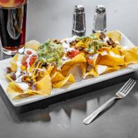 Loaded Nachos · Made to order Crispy tortilla chips topped with melted cheese, Pico de Gallo, sour cream, gu...
