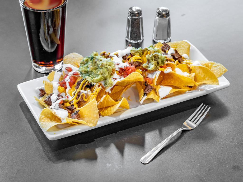Loaded Nachos · Made to order Crispy tortilla chips topped with melted cheese, Pico de Gallo, sour cream, guacamole, shredded cheese. Add your choice of protein for extra.