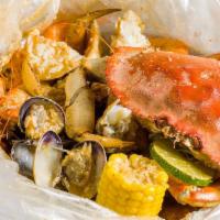 Combo D · Dungeness crab, big head shrimp, clam, corn and potato.