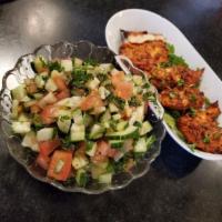 Israeli Salad · Diced cucumber, tomato, parsley, & mint, seasoned with fresh squeezed lemon juice & Israeli ...