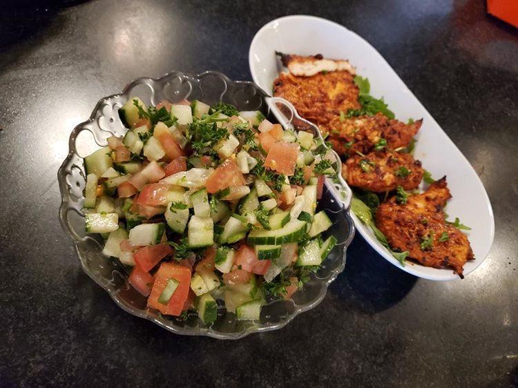 Israeli Salad · Diced cucumber, tomato, parsley, & mint, seasoned with fresh squeezed lemon juice & Israeli extra virgin olive oil, homemade tahini, & sumac. 
