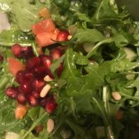 Arugula Salad · Arugula greens, tomato, cucumber, topped with pine nuts and mixed with pomegranate dressing.