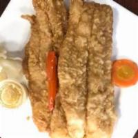 Filete de Pescado al Gusto · Fish filet any style. Servido a la plancha, empanizado, al ajillo o chilao. Served grilled, ...