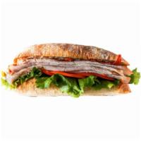 Turkey Club Signature Sandwich · Boar’s Head® Ovengold Turkey breast with bacon, lettuce, tomato and mayo.