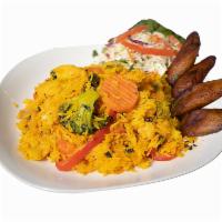 11. Vegan Plate · Rice with vegetables, onion, bell pepper, cilantro. Served with deep fried plantain and salad.