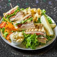 Turkey Club Sandwich · Turkey breast, crispy bacon, lettuce, tomato and mayo.