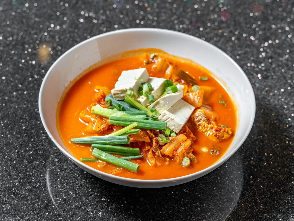 6. Kimchi Stew · Spicy stew made with ripened. Kimchi, pork, tofu, garlic, onion, scallion and radish. Serving with white or brown rice.
