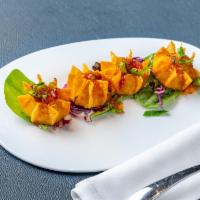 Sweet Plantain Ragoons · Fried sweet plantain and cheese wontons served with passion fruit sweet chili sauce.