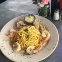 Garlic Shrimp Pasta · Garlic shrimp linguine with white wine butter sauce with diced tomatoes, and red chili flakes.