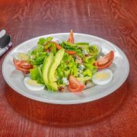 Cobb Salad · Romaine lettuce, tomato, crispy bacon, grilled chicken, hard boiled eggs, avocado, blue chee...