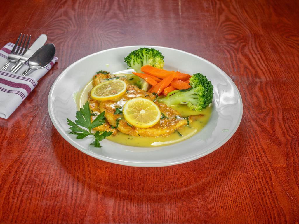 Flounder Francese · Filet of flounder, lemon white wine sauce, sauteed vegetables and mashed potatoes.
