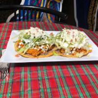 Tostadas · 2 flat fried tortillas topped with bean sauce, a choice of meat, lettuce, diced tomatoes and...