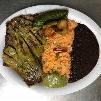 Cecina Asada con Nopales cebollitas y jalapeños asados · Cured beef with grilled nopales, jalapenos and onions. Served with rice, beans and tortilla ...