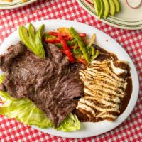 La Tampiquena · Cecina Asada with 2 enchiladas with mole sauce, Sauteed onions and peppers and 1/4 of avocad...