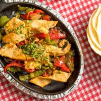 Chicken Fajitas · Served with Rice refried beans and Tortillas
Servido con arroz frijoles y tortillas