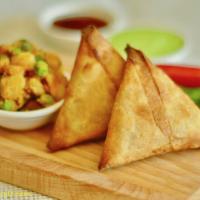 Vegetable Samosa · Fried pastry filled with masala potato and peas. Served with tamarind sauce.