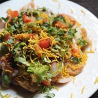 Chaat Papri · Savory snack made with sev chips, potato and spices with yogurt and chutney.