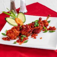 Drums of Heaven · Tender chicken wings marinated with fresh chili and garlic wok fried.