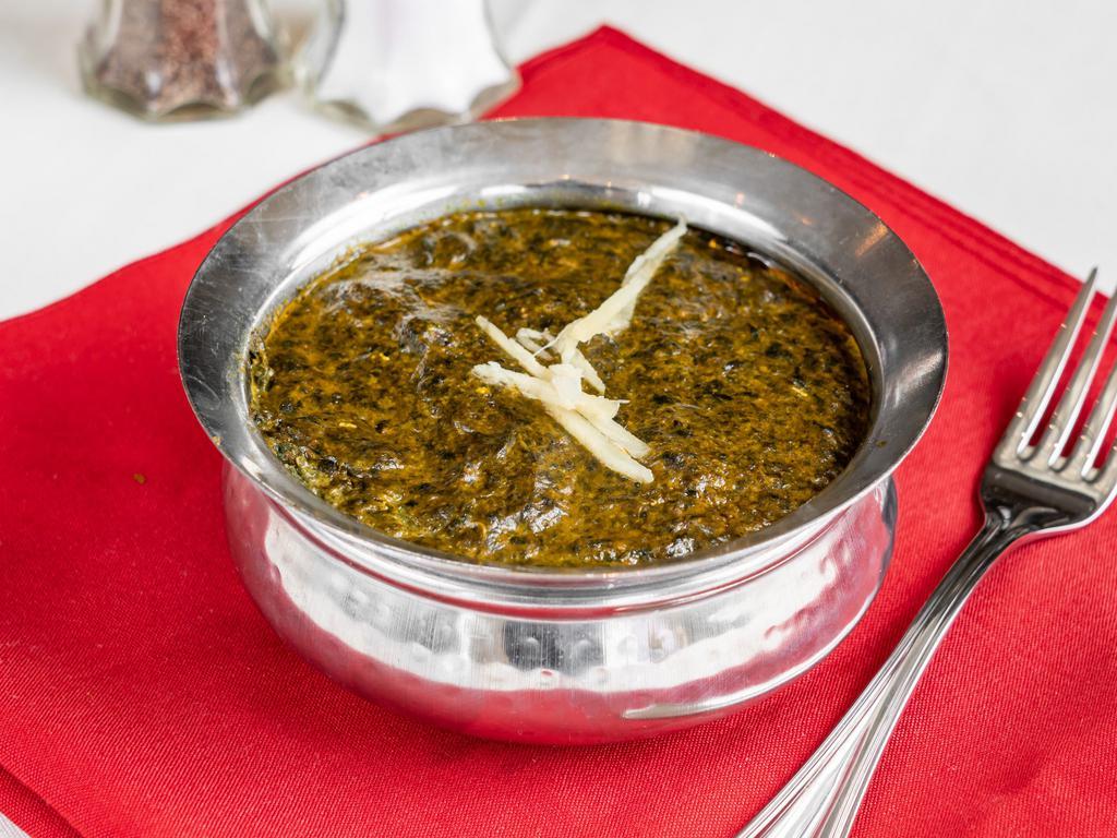 Saag Paneer · Fresh spinach and cottage cheese cooked with fresh mild spices.