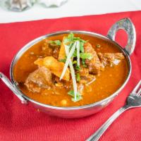 Vindaloo · Lamb or goat marinated and cooked in a hot vindaloo red sauce.
