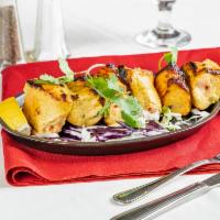 Fish Tikka  · Grilled fish served with lemon, rice and spicy chutney.