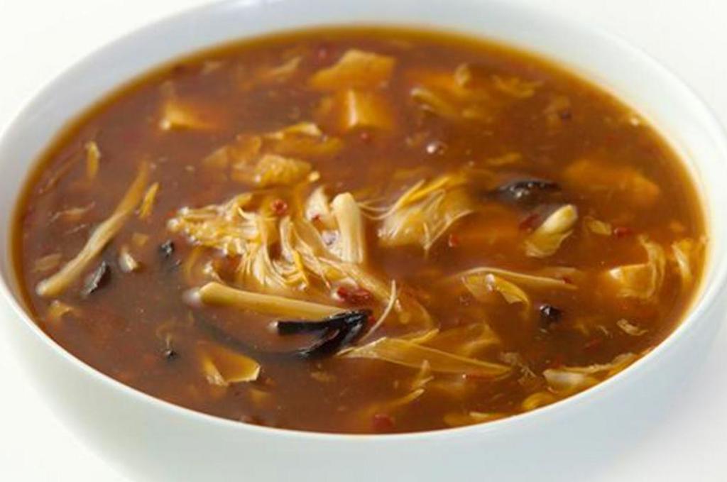 Hot and Sour Soup · Savoury, spicy and tangy. Filled with mushrooms, tofu, bamboo shoots and silky egg ribbons. 