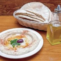 Hummus plate · A blend of pureed chickpeas delicately flavored with sesame oil, lemon juice and Middle East...
