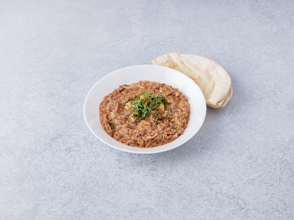 Foule Moudammas · Baked fava beans Middle Eastern style. 