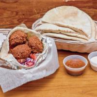 Falafel Sandwich · On a pita with lettuce, tomato and more. Vegetarian. 