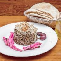 Mujadera · Lentil rice with sauteed onion, served with yogurt or salad. 