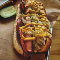 Grunt · Split and seared Hoffman's, nestled in crispy fried salami, food and ferments kraut and yell...