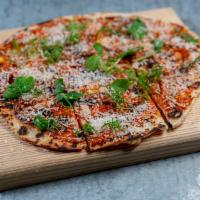 Tomato and Parmesan Flatbread · Flat unleavened bread usually topped with cheese, sauce, meats and veggies.