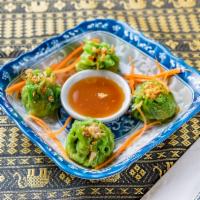 9.  Steamed Vegetable Thai Dumpling · 4 pieces. Served with Thai ginger soy sauce.