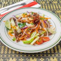 17. Crispy Duck Salad · Crispy duck, tomatoes, apple, cashew nuts and lime juice in chili sauce.