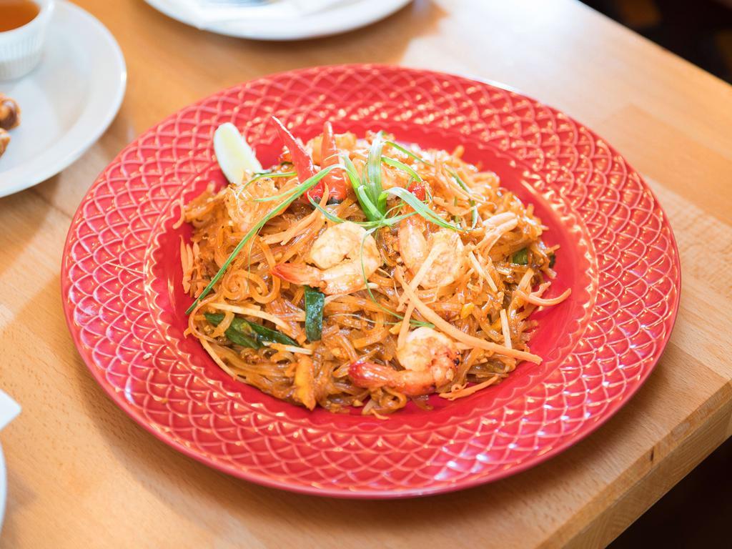 22. Pad Thai · Stir fried rice noodles with egg, scallion, bean sprouts topped with crushed peanuts. 