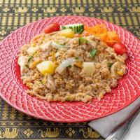 28. Pineapple Fried Rice · Pineapple, eggs in soy sauce.