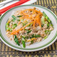 29. Vegetable Fried Rice · Stir fried rice, carrots, string beans in soy sauce.