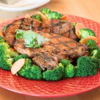 40. Grilled Pork Chops Thai Style · Marinated pork chops. Served with cucumber salad or cilantro hot sauce.