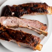 1/2 rack of Ribs · 1/2 Rack of slow cooked - tender fall off the bone ribs slathered in your choice of sauce.