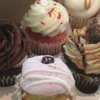 6 Large Assorted Cupcakes · Baker's choice. 6 assorted cupcakes.