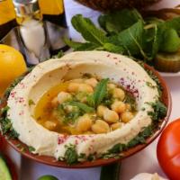 HumMUST · Finely ground cooked chickpeas blended with tahini, lemon, garlic, Middle-Eastern seasonings...