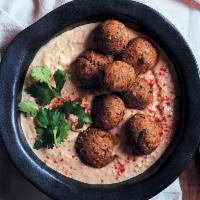 Hummus with Balls of Falafel Silky Smooth Hummus · Silky smooth hummus-finely ground cooked chickpeas blended with tahini, lemon, garlic, Middl...