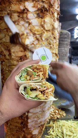 Shower me in Shawarma · Middle-Eastern specialty assortment of thinly sliced chicken with garlic sauce and pickles wrapped in thin homemade pita bread.