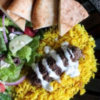 Arabic Meatball Kofta Kebob Platter · Grilled ground lamb and beef seasoned with middle-eastern seasoning with a side of rice, sal...