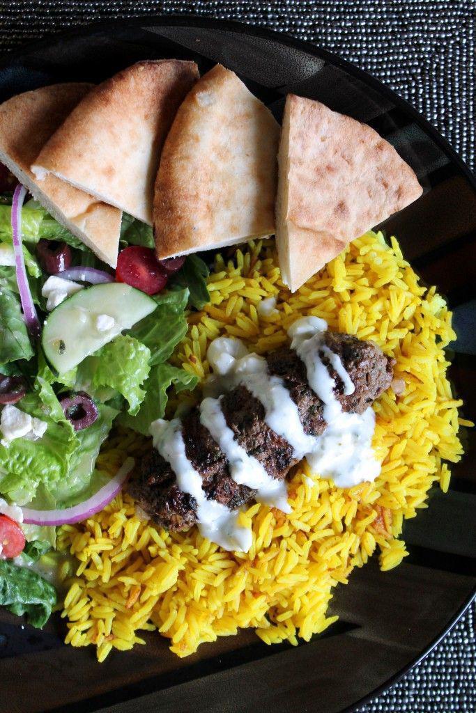 Arabic Meatball Kofta Kebob Platter · Grilled ground lamb and beef seasoned with middle-eastern seasoning with a side of rice, salad, and pickles, served with homemade pita bread and tahini sauce.