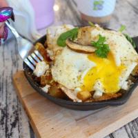 Grecian Skillet · On a bed of home-style potatoes, veggies, cheese and 2 over easy eggs.