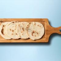 Pita Bread · Fresh yeast-leavened round flat-breads baked from wheat flour.
