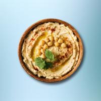 Easy Hummus · Chickpeas boiled till soft, mashed, blended, and mixed with garlic, tahini sauce, olive oil,...